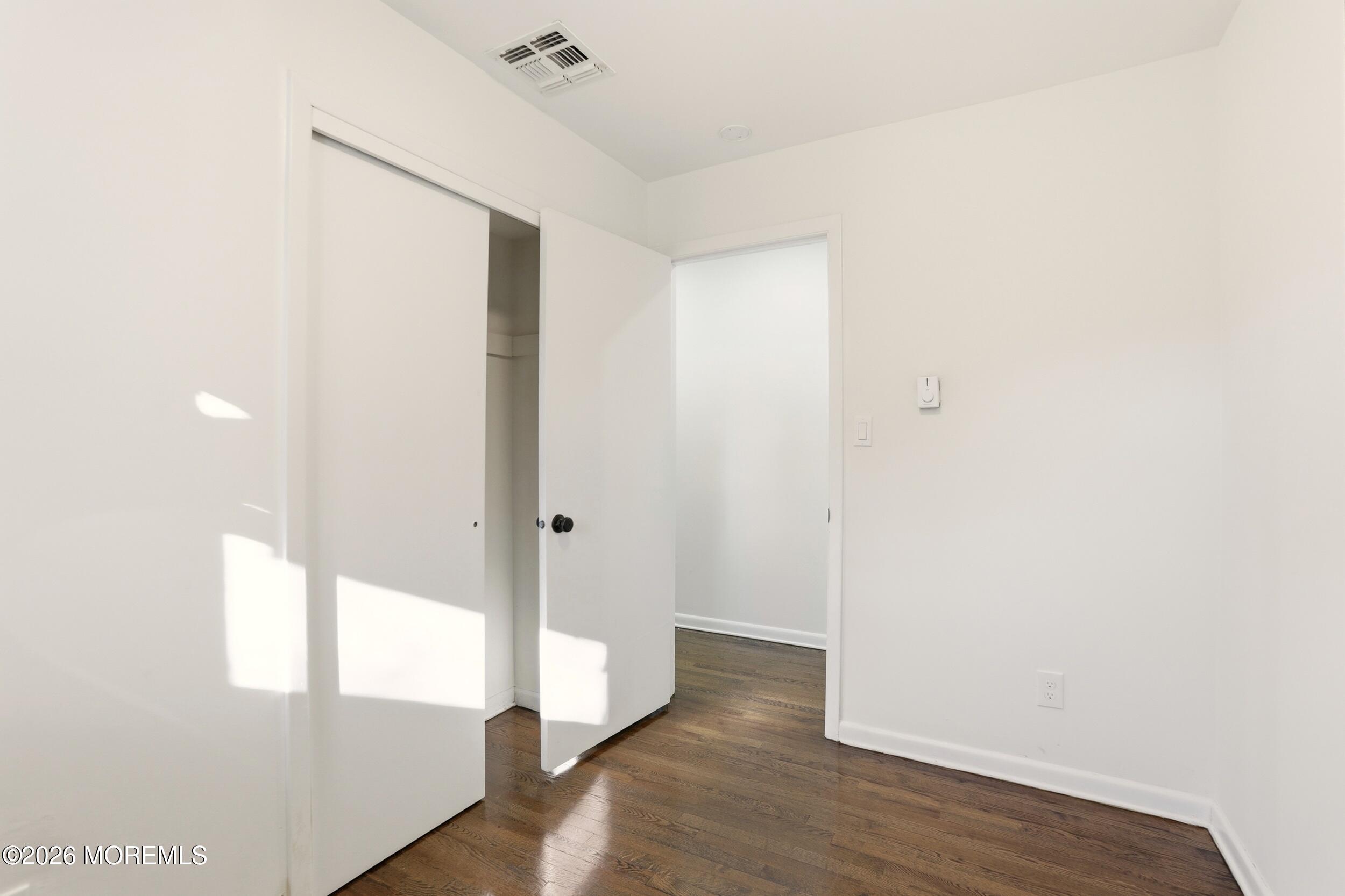 9 Riccis Drive Jackson, NJ 08527 - Photo 6 of 30 a view of an empty room with wooden floor