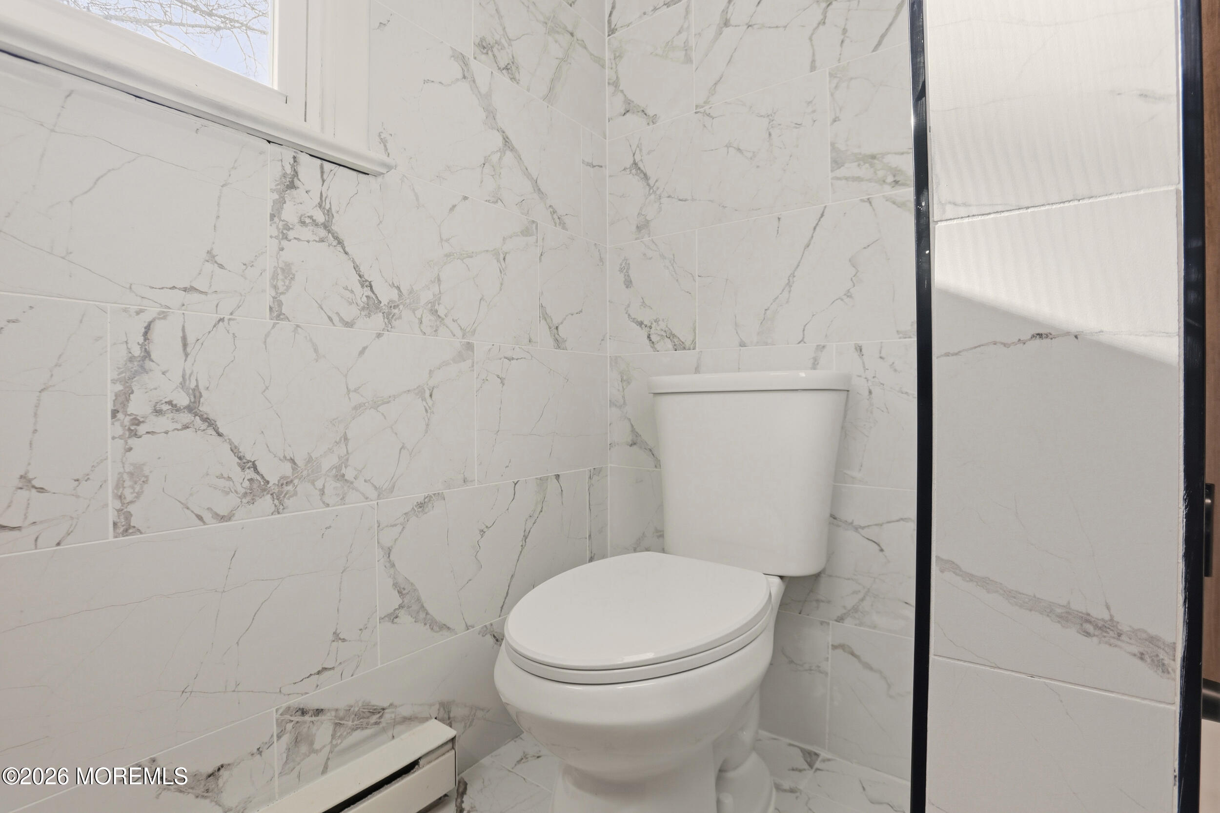 9 Riccis Drive Jackson, NJ 08527 - Photo 9 of 30 a white toilet sitting next to a shower