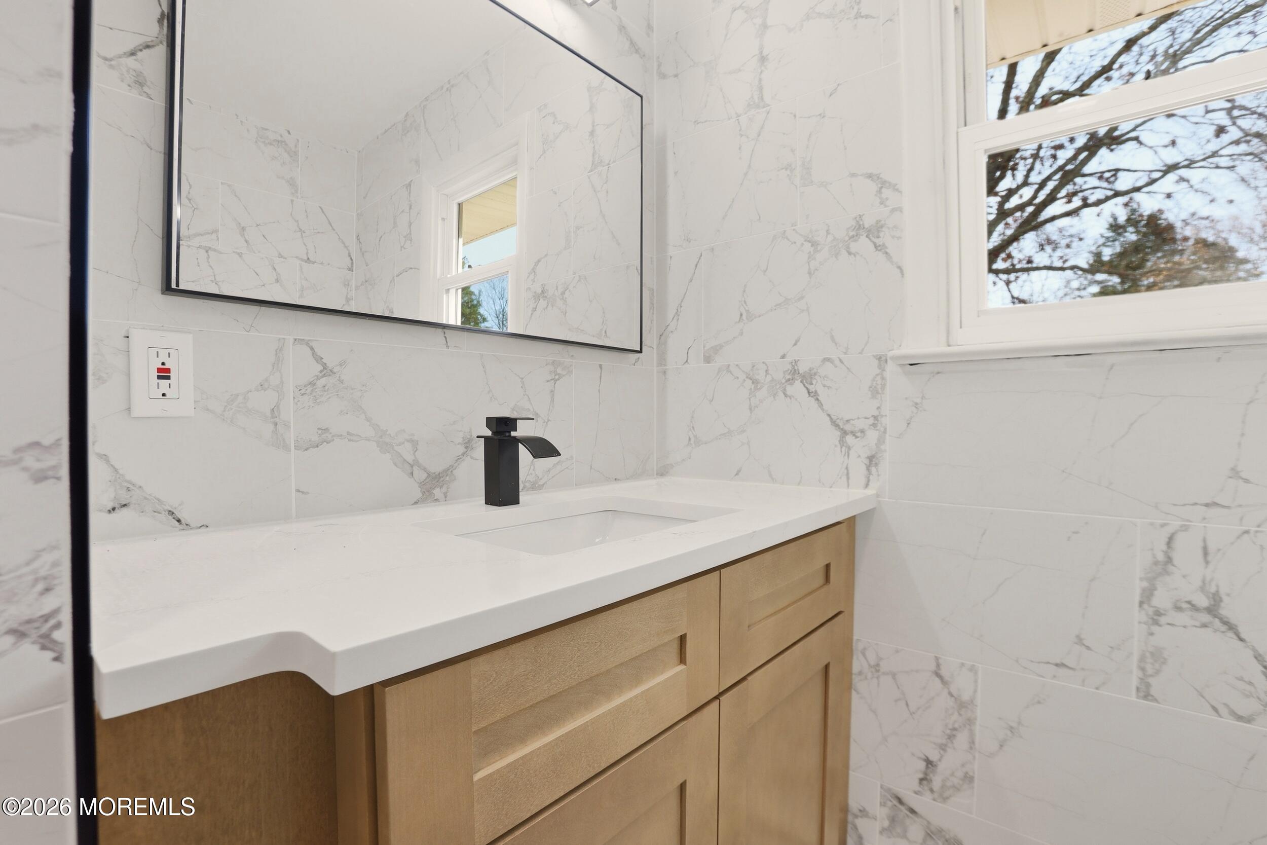 9 Riccis Drive Jackson, NJ 08527 - Photo 10 of 30 a bathroom with a sink and a mirror