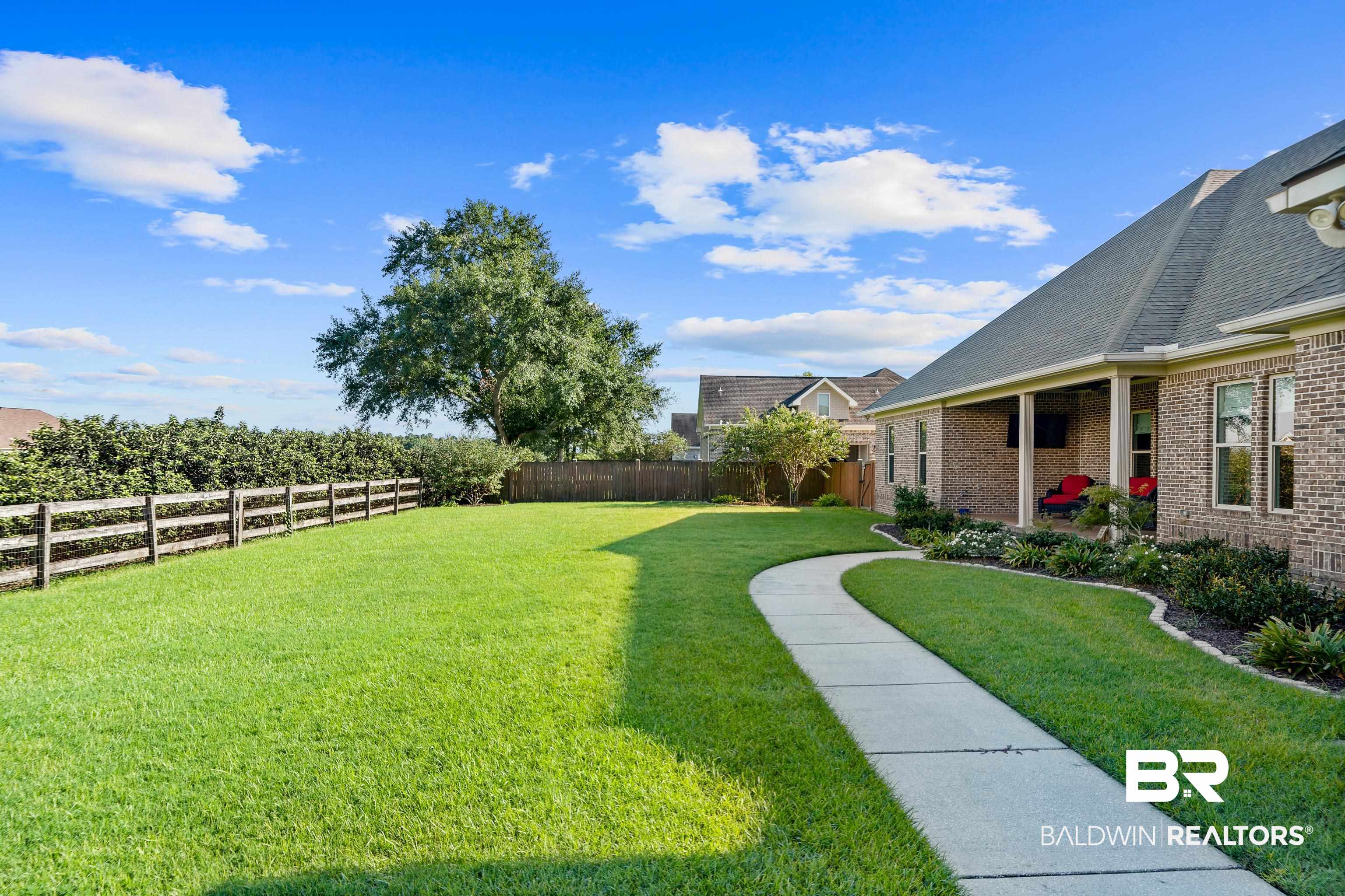 17663 Burwick Loop Fairhope, AL 36532 - Photo 40 of 41 View of yard featuring a patio area