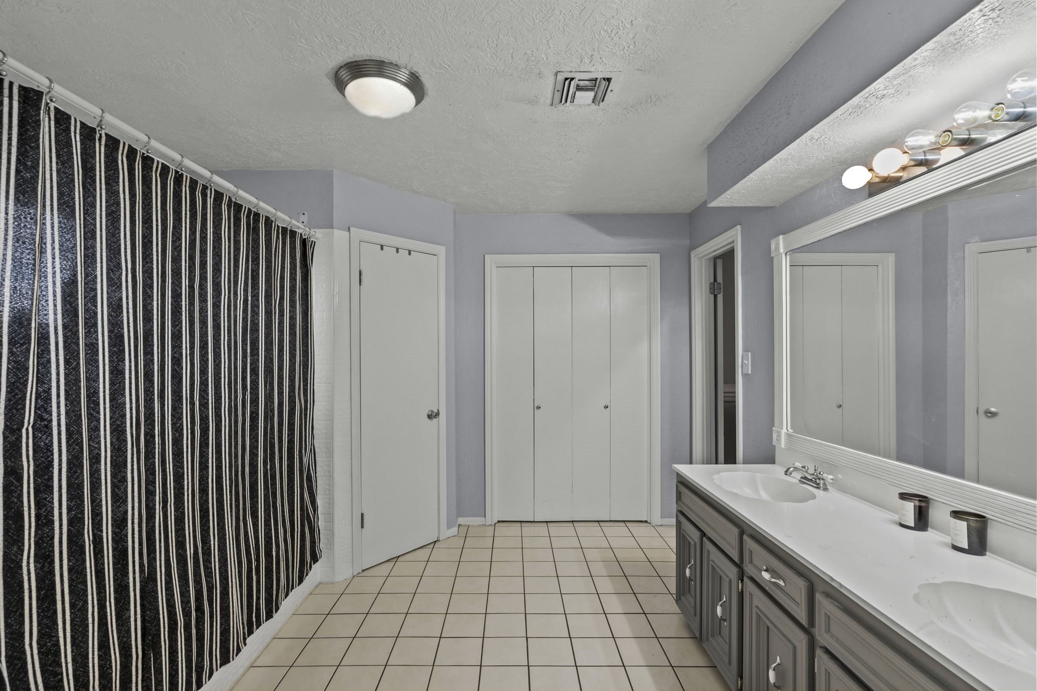 7009 Avenue R Santa Fe, TX 77510 - Photo 22 of 48 Primary bathroom with double sinks and plenty of storage.