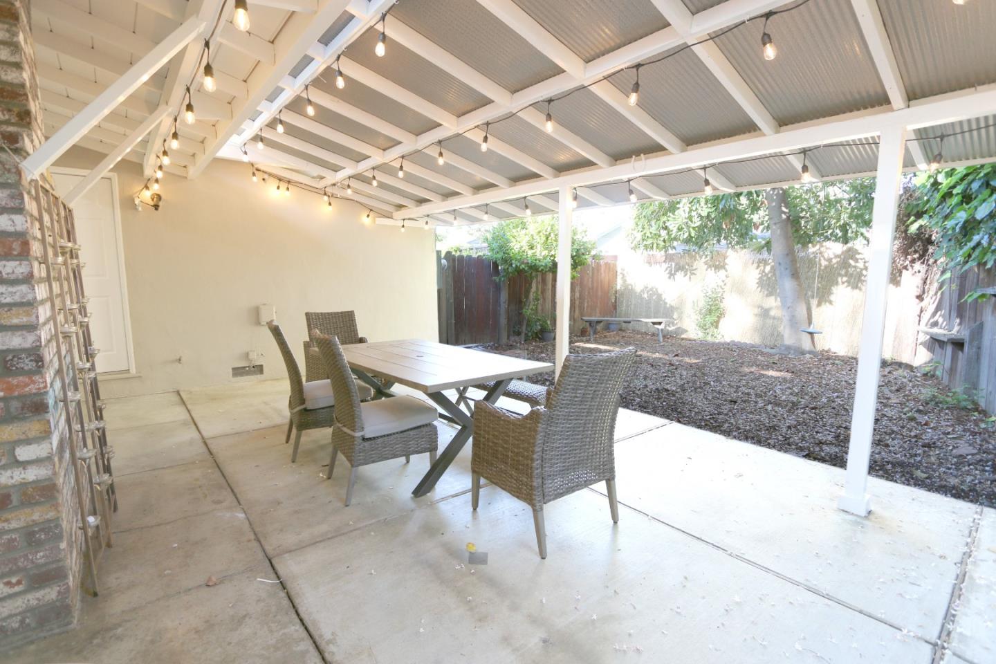 1104 Phyllis Avenue Mountain View, CA 94040 - Photo 11 of 12 a outdoor space with lots of tables a chair and a glass door