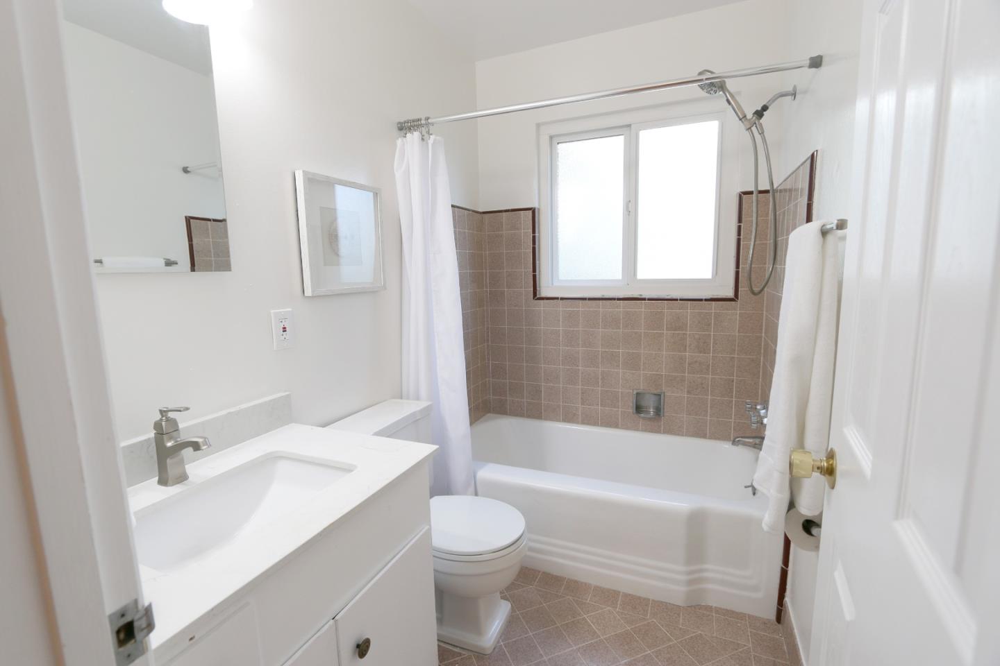 1104 Phyllis Avenue Mountain View, CA 94040 - Photo 9 of 12 a bathroom with a sink toilet tub and shower