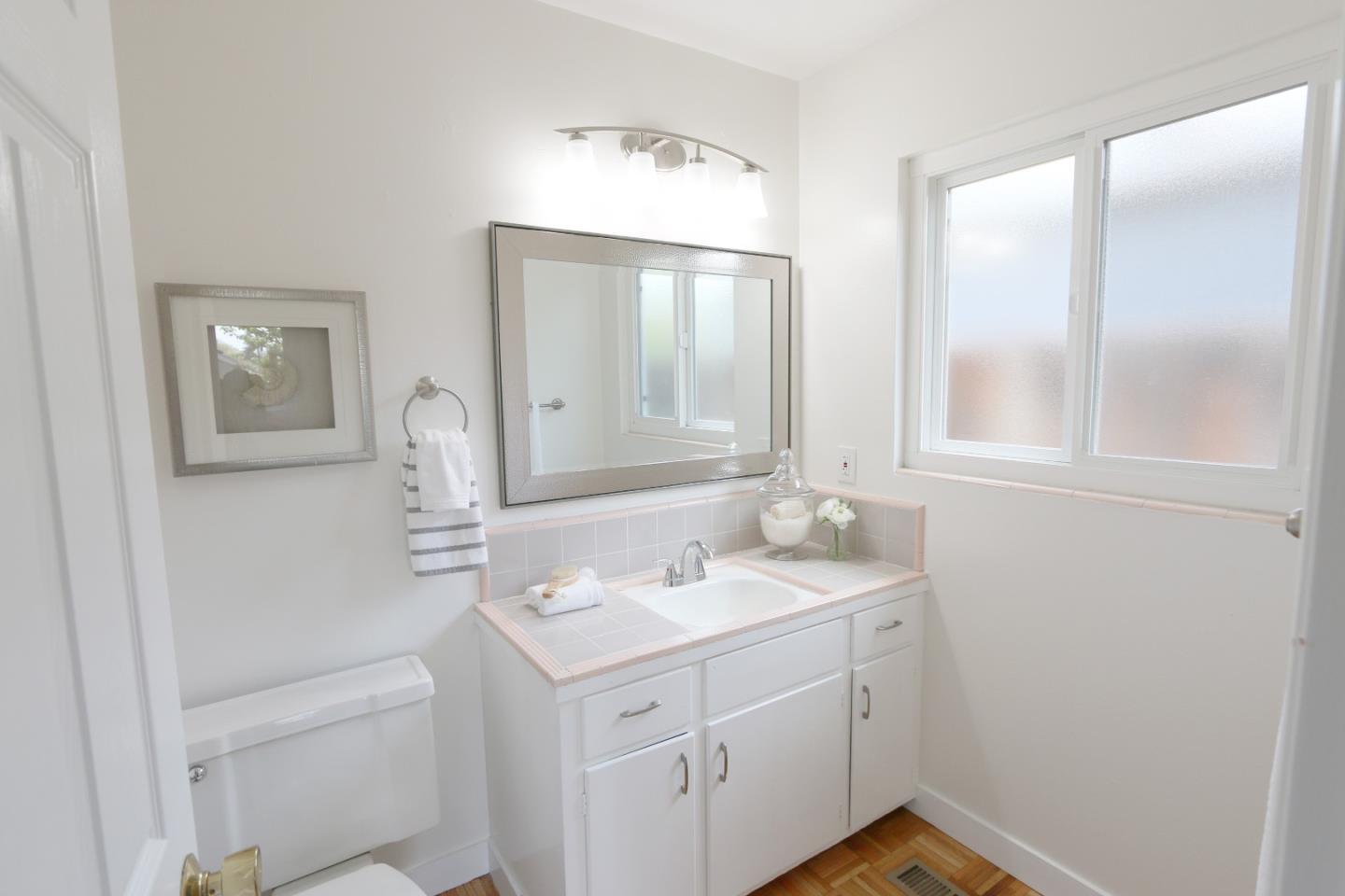 1104 Phyllis Avenue Mountain View, CA 94040 - Photo 10 of 12 a bathroom with a sink and a mirror