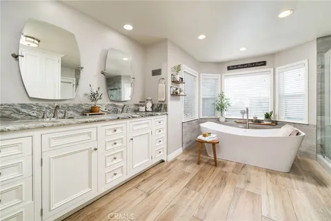 a view of a patio with table and chairs and potted plants