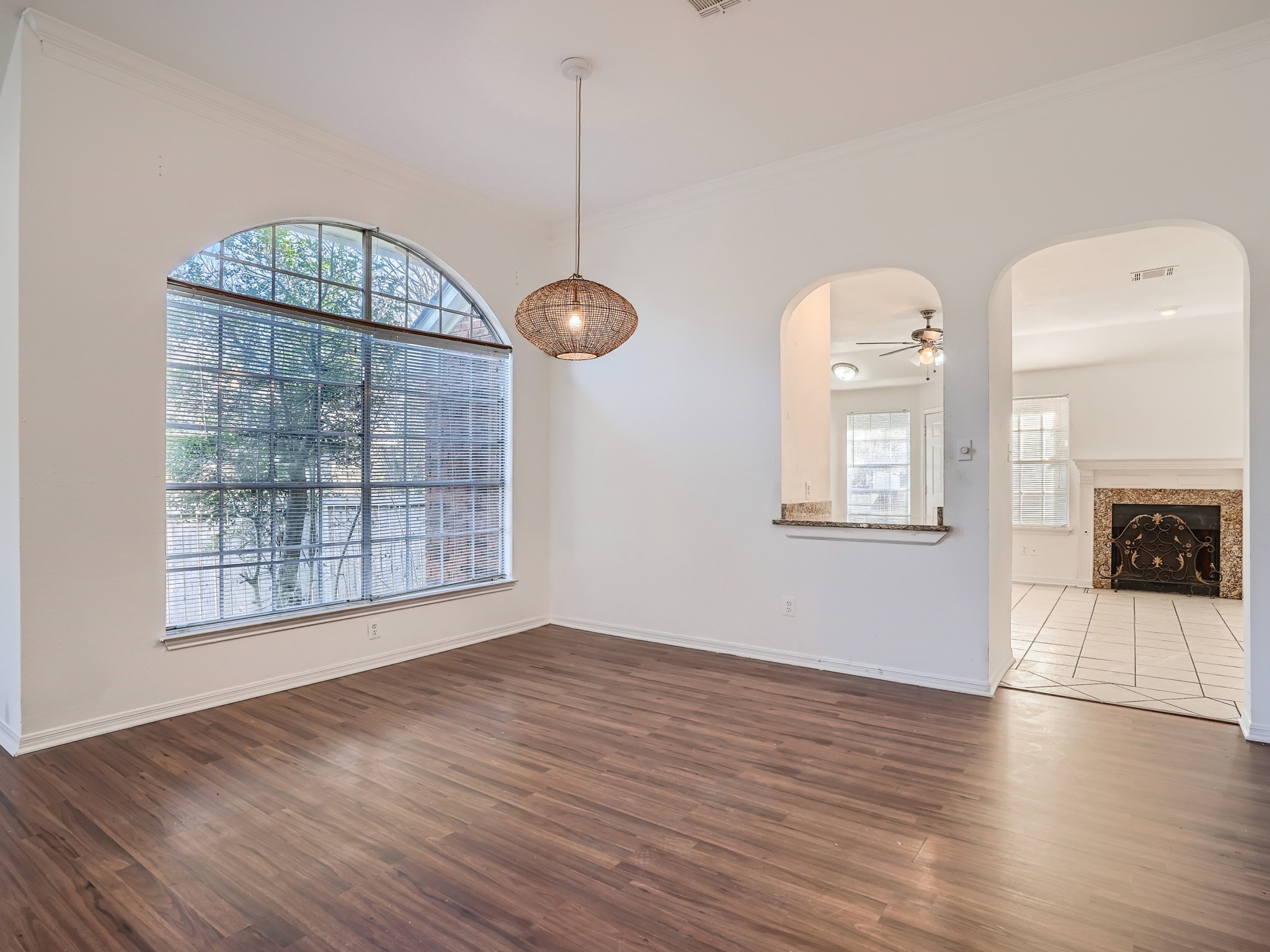 811 Canyon Bend Road Pflugerville, TX 78660 - Photo 3 of 11 a view of an empty room with wooden floor and a window