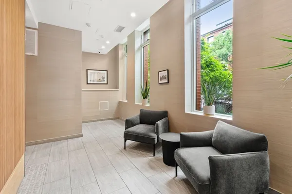 a living room with furniture and a window
