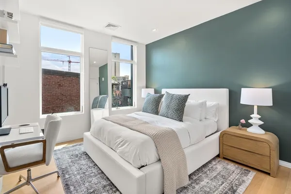 a bed room with a bed and a couch