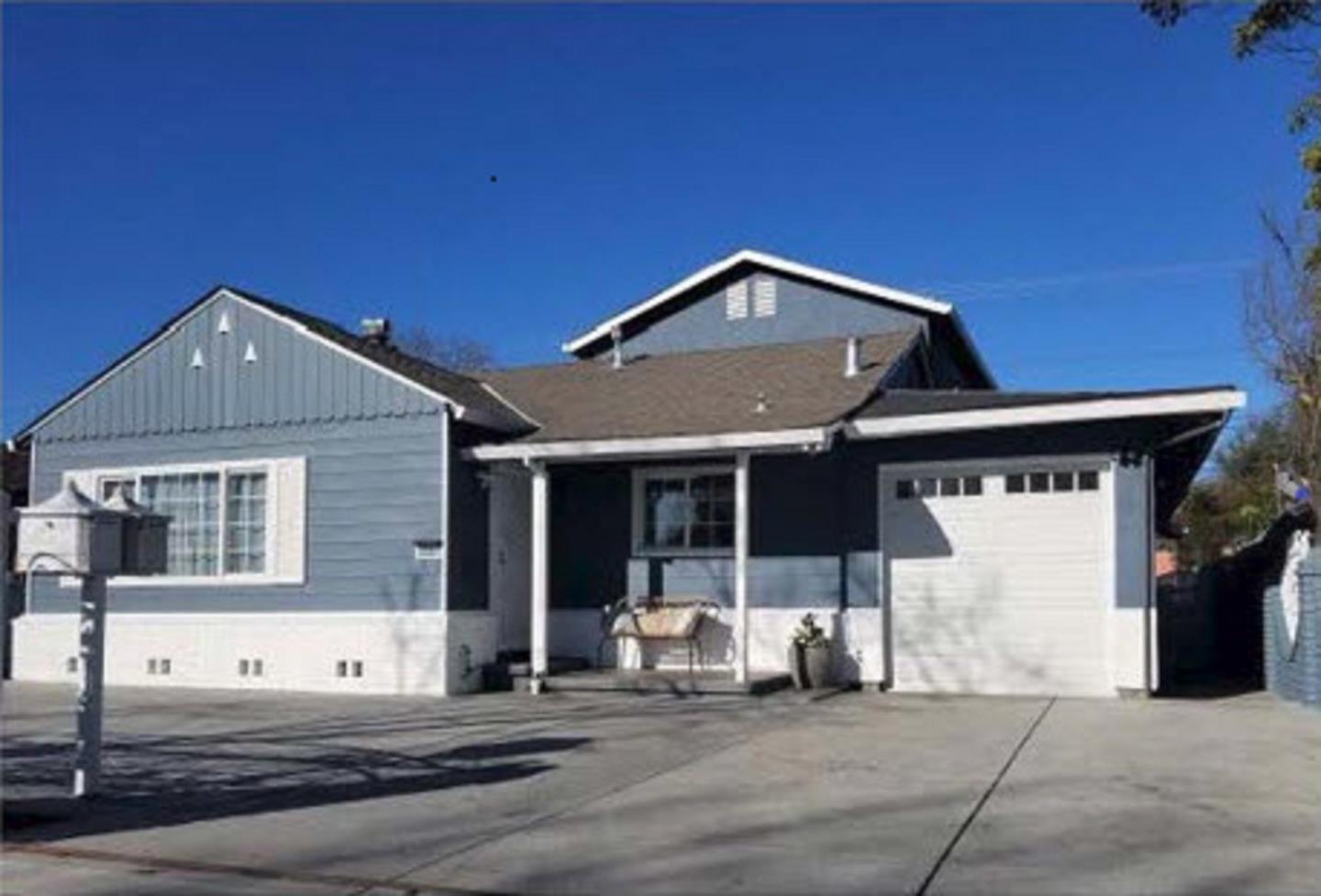 a front view of a house with a garage