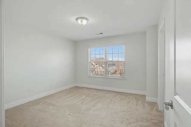 a bathroom with a toilet a sink a tub and mirror