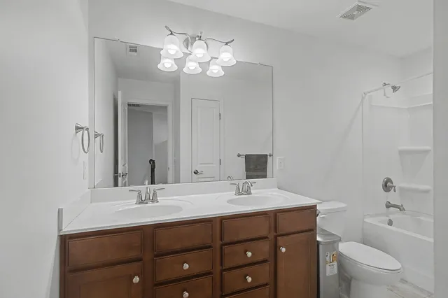 a bathroom with a shower and a toilet