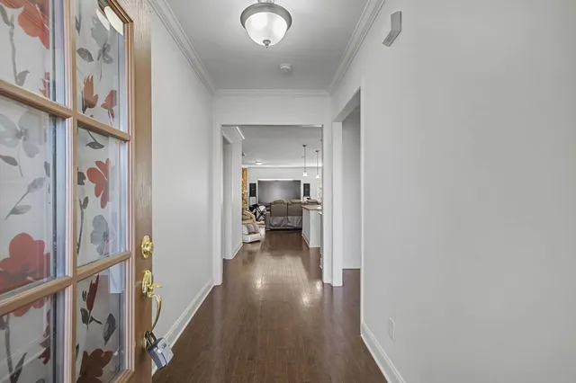 an empty room with painting on the wall