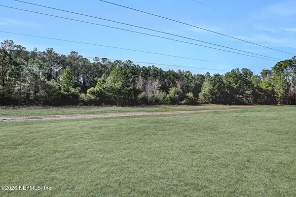a view of a field with an outdoor space