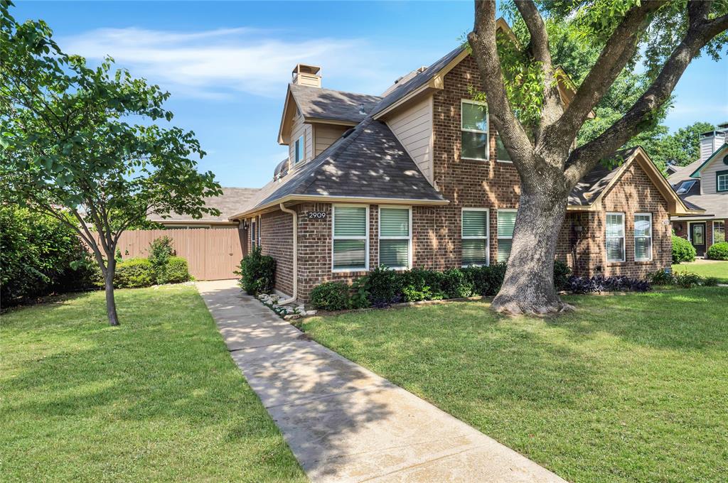 2909 Normandy Court Euless, TX 76039 - Photo 34 of 36 a front view of a house with a yard