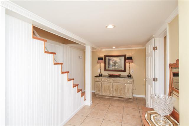 220 Jackson Heights Road Columbia, TN 38401 - Photo 14 of 18 Downstairs hallway to staircase leading upstairs.