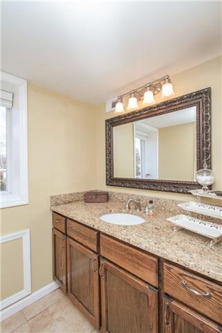 220 Jackson Heights Road Columbia, TN 38401 - Photo 15 of 18 Full bath with tile floor, tile shower and granite vanity.