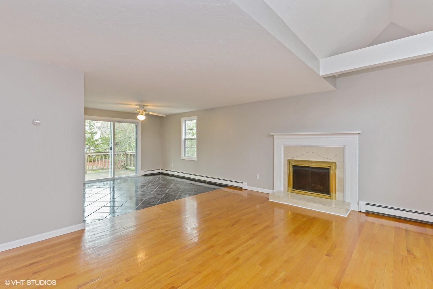 197 Shootflying Hill Road Centerville, MA 02632 - Photo 3 of 15 a view of an empty room with window and wooden floor