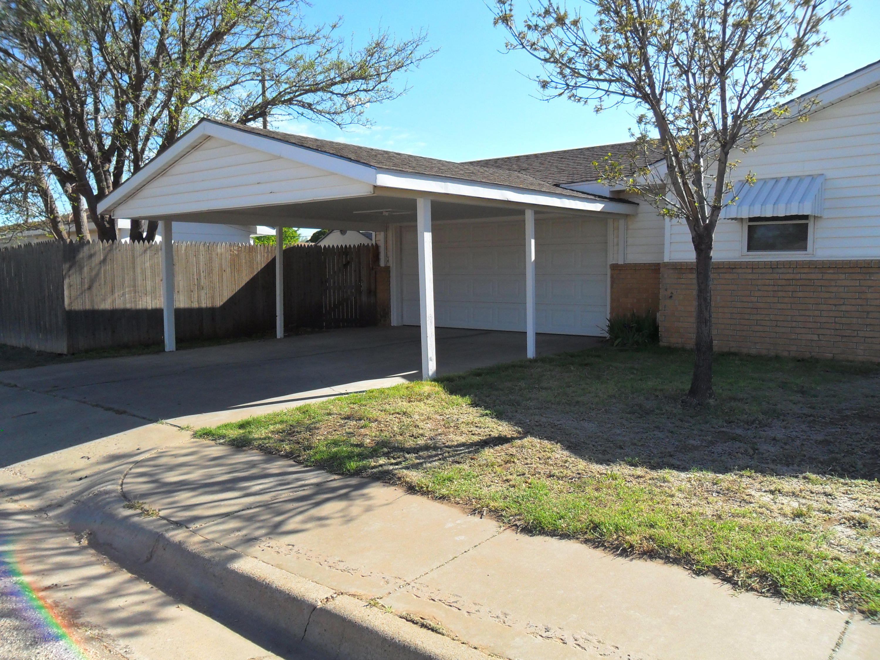 2216 Southwest 52nd Avenue Amarillo, TX 79110 - Photo 1 of 21 a front view of a house with garden