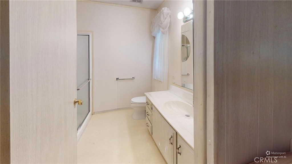 14851 Jeffrey Road, Unit 117 Irvine, CA 92618 - Photo 30 of 45 a bathroom with a granite countertop sink and a mirror