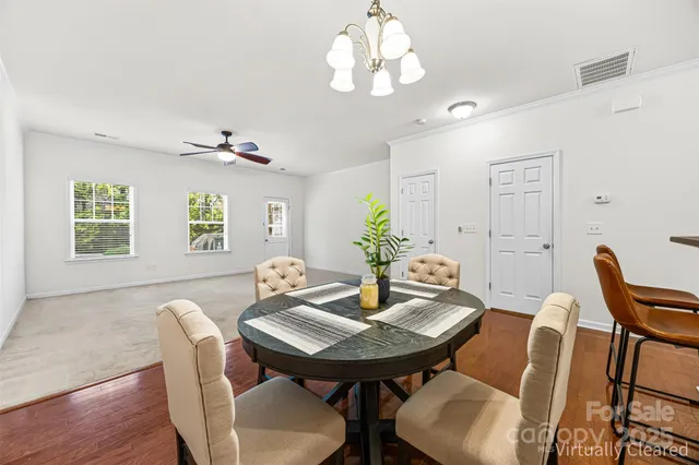a view of a dining room with furniture and window