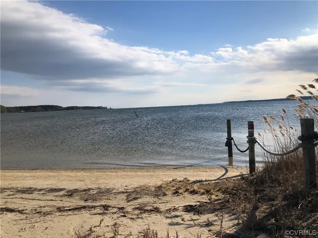 a view of lake with mountain in background