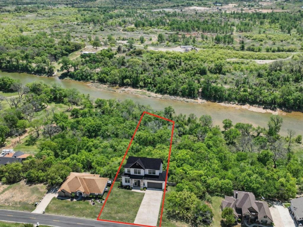 9804 Bellechase Road Granbury, TX 76049 - Photo 1 of 18 True Brazos River frontage in Pecan Plantation. Virtual rendering shown for illustration only. Lot is vacant.