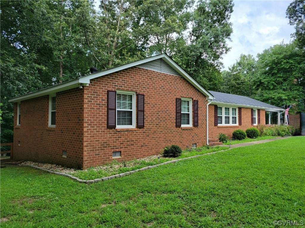 10301 Robbie Road Chesterfield, VA 23832 - Photo 2 of 21 a front view of a house with a garden