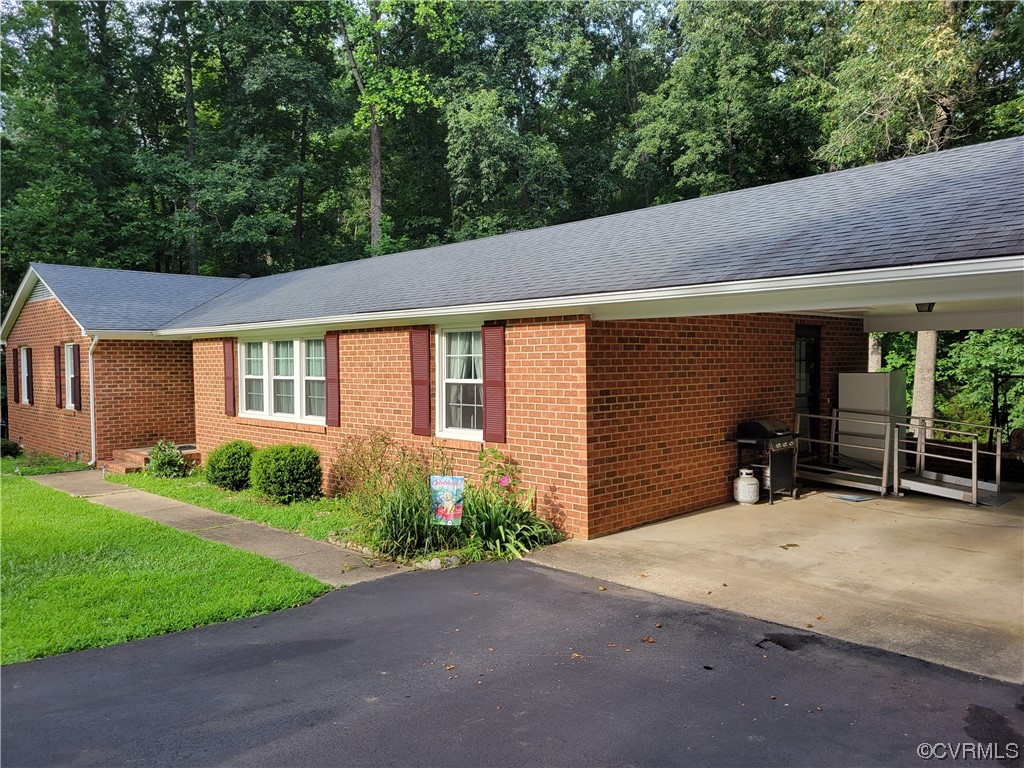 10301 Robbie Road Chesterfield, VA 23832 - Photo 5 of 21 a view of a house with a yard