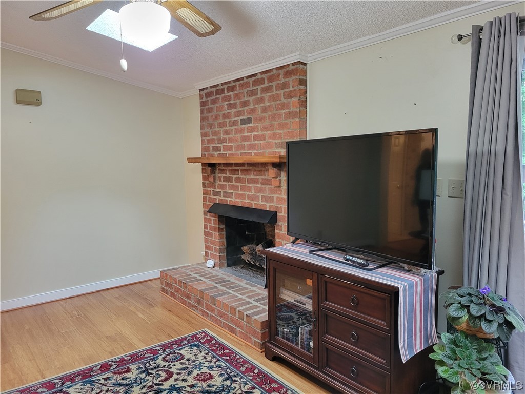 10301 Robbie Road Chesterfield, VA 23832 - Photo 7 of 21 a living room with furniture and a flat screen tv