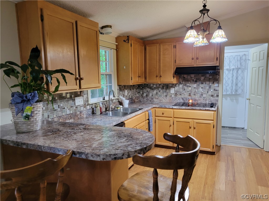 10301 Robbie Road Chesterfield, VA 23832 - Photo 10 of 21 a kitchen with a sink a stove and chairs