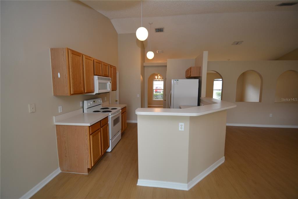 5 Kathleen Trail Palm Coast, FL 32164 - Photo 11 of 38 a kitchen with stainless steel appliances granite countertop a stove a sink and a microwave