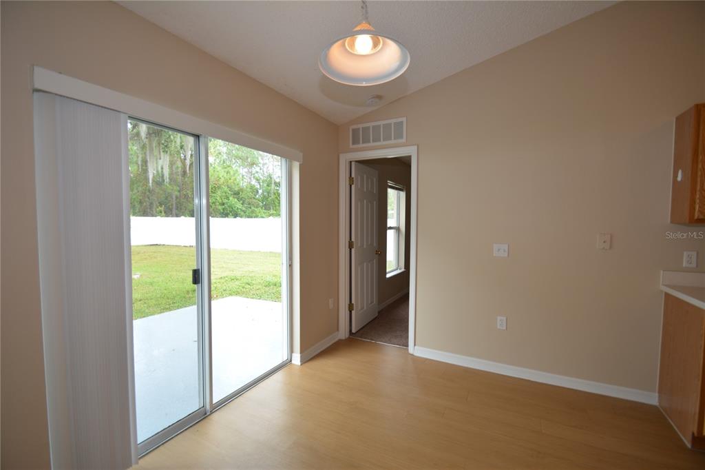 5 Kathleen Trail Palm Coast, FL 32164 - Photo 21 of 38 a view of an empty room with a window