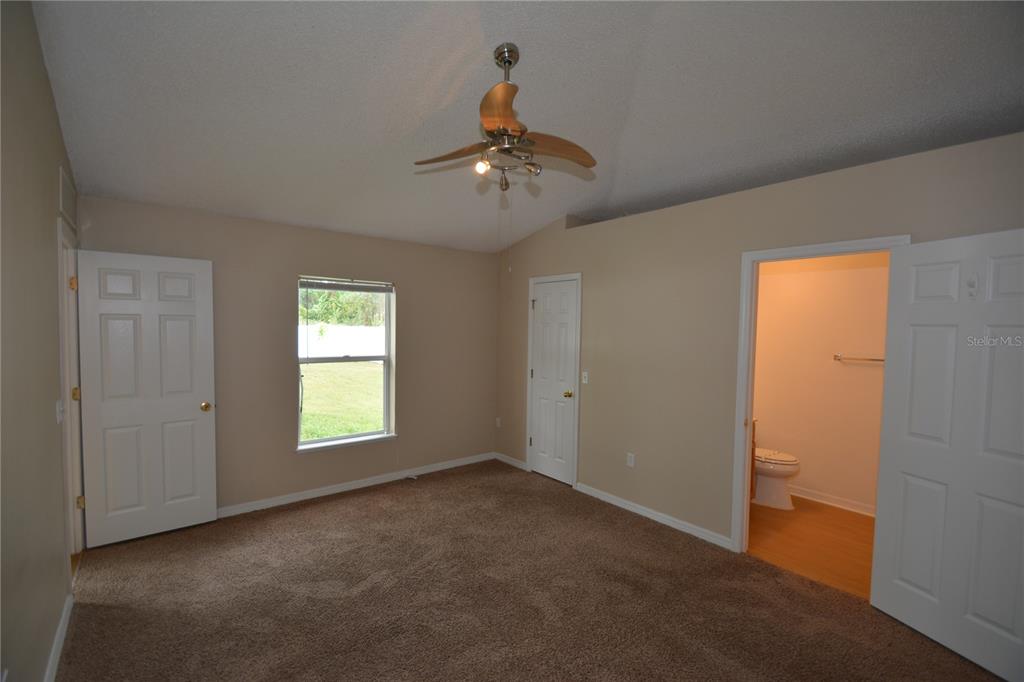 5 Kathleen Trail Palm Coast, FL 32164 - Photo 23 of 38 a view of an empty room with a window
