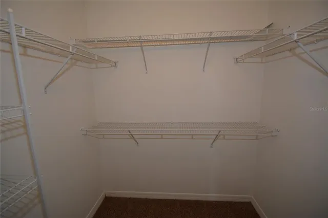a view of a room with racks on the wall