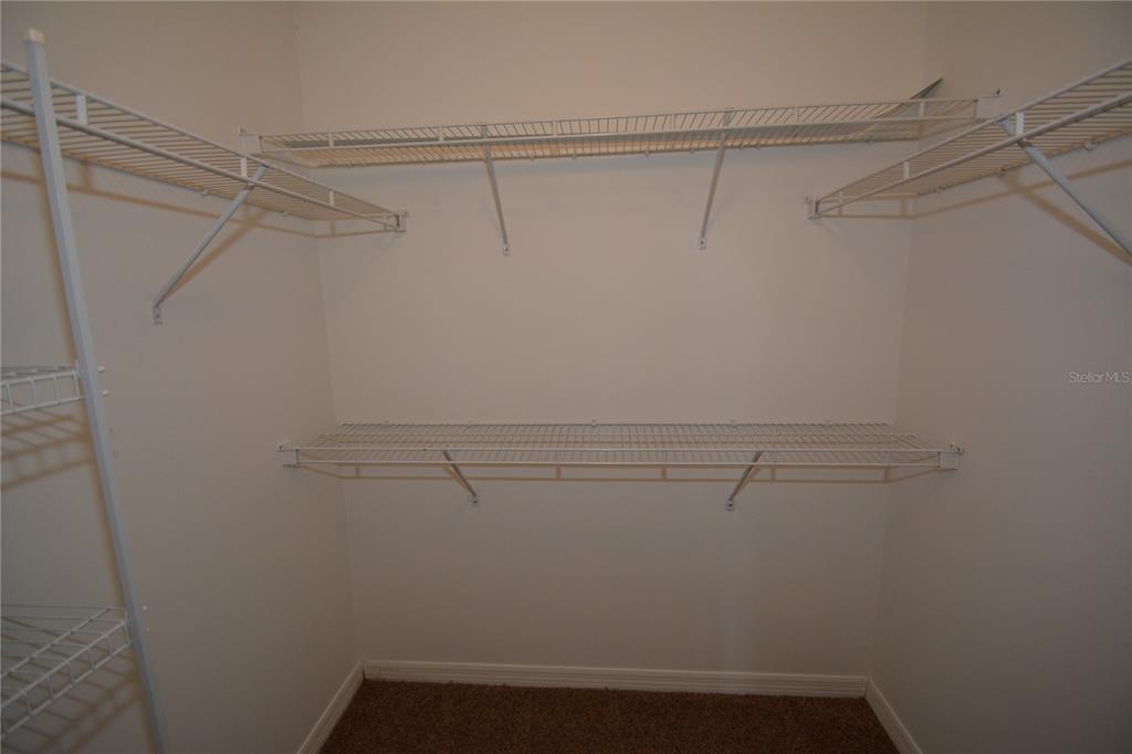 5 Kathleen Trail Palm Coast, FL 32164 - Photo 24 of 38 a view of a room with racks on the wall