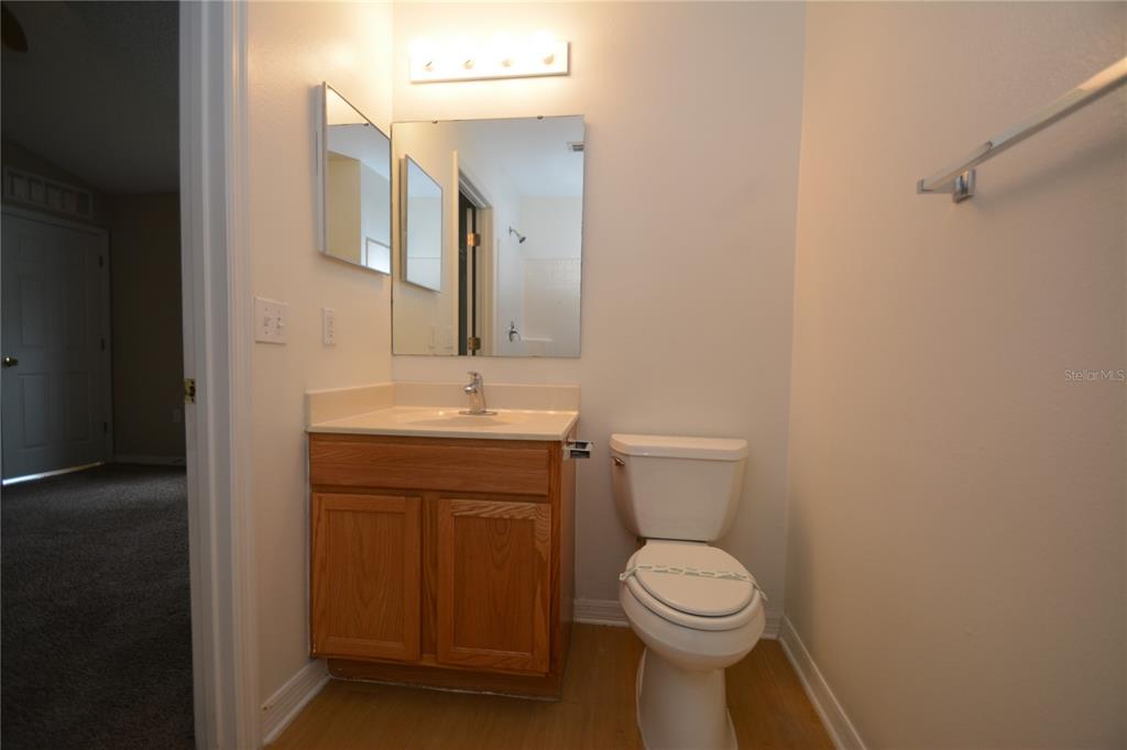 5 Kathleen Trail Palm Coast, FL 32164 - Photo 25 of 38 a bathroom with a toilet sink and mirror