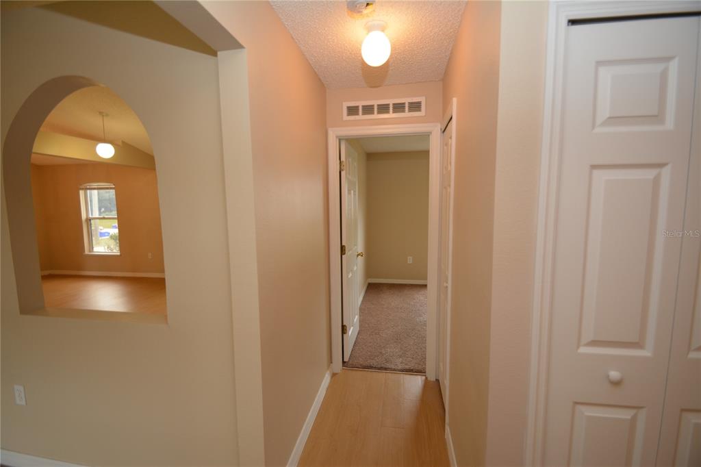 5 Kathleen Trail Palm Coast, FL 32164 - Photo 28 of 38 a view of a hallway with wooden floor
