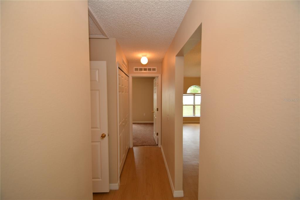 5 Kathleen Trail Palm Coast, FL 32164 - Photo 31 of 38 a view of a hallway with wooden floor