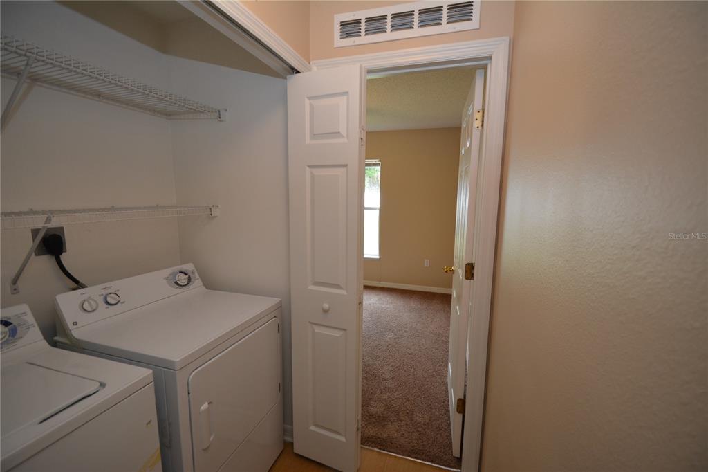 5 Kathleen Trail Palm Coast, FL 32164 - Photo 32 of 38 a utility room with dryer and washer