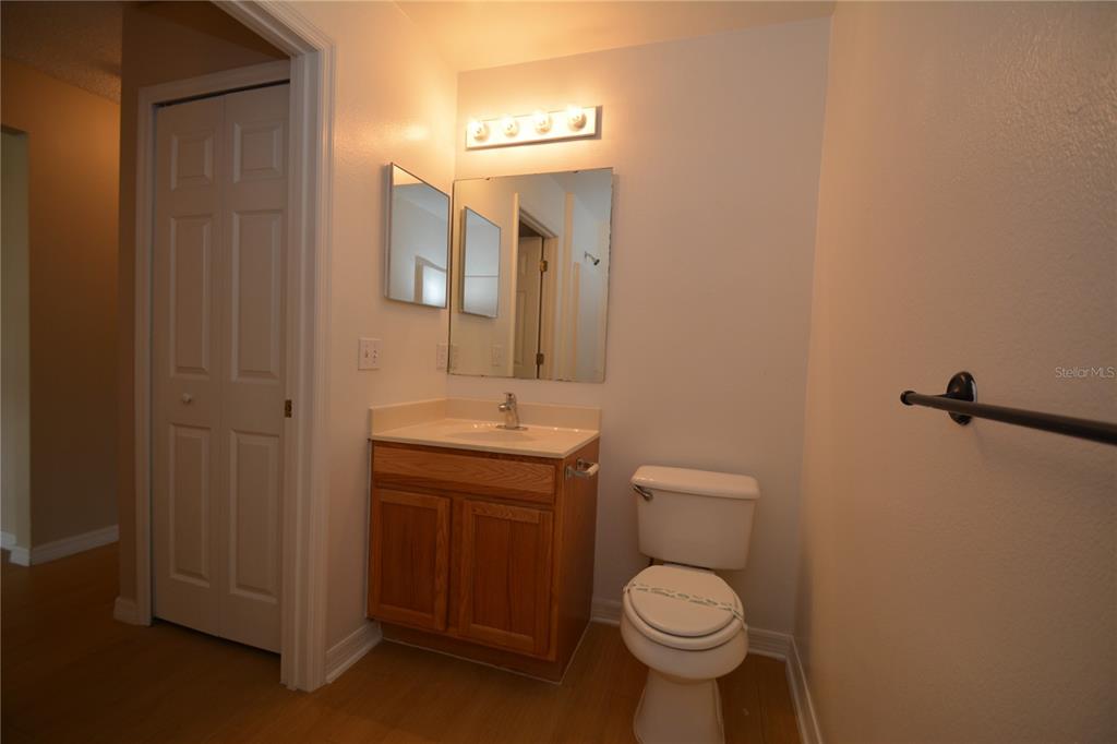 5 Kathleen Trail Palm Coast, FL 32164 - Photo 36 of 38 a bathroom with a toilet sink and mirror