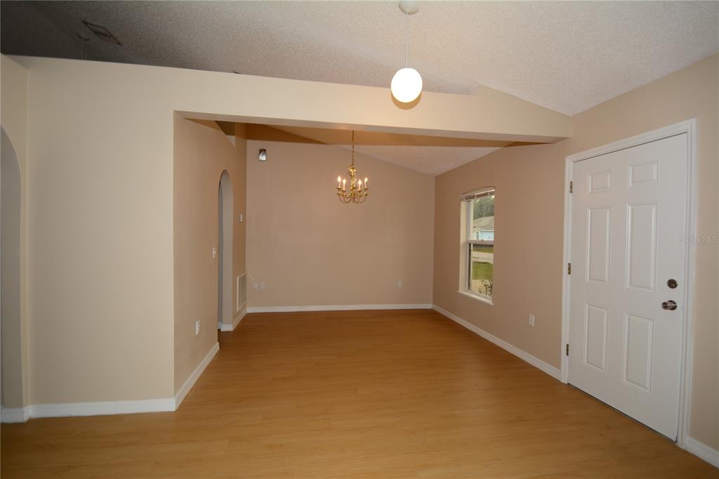 5 Kathleen Trail Palm Coast, FL 32164 - Photo 4 of 38 a view of an empty room and window