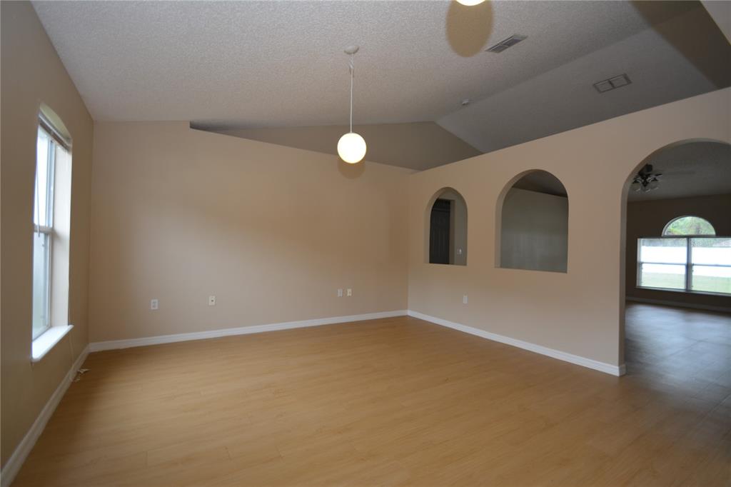 5 Kathleen Trail Palm Coast, FL 32164 - Photo 6 of 38 an empty room with windows