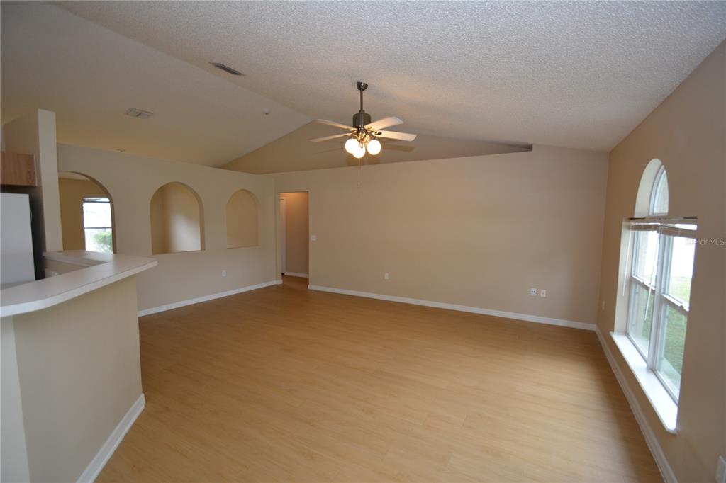 5 Kathleen Trail Palm Coast, FL 32164 - Photo 10 of 38 wooden floor in an empty room with a window