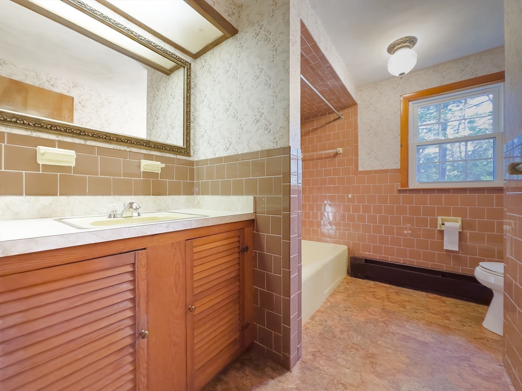 130 S Road Holden, MA 01520 - Photo 15 of 28 a bathroom with a sink and a bathtub