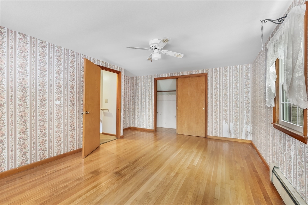 130 S Road Holden, MA 01520 - Photo 18 of 28 an empty room with wooden floor and windows