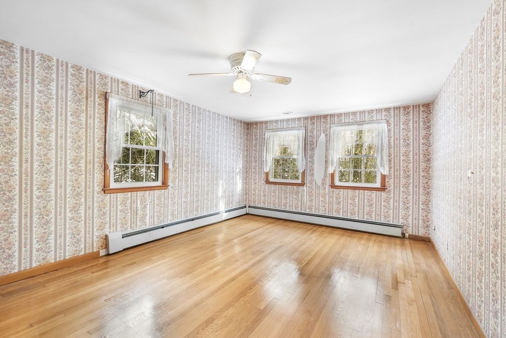 130 S Road Holden, MA 01520 - Photo 19 of 28 wooden floor in an empty room with a window