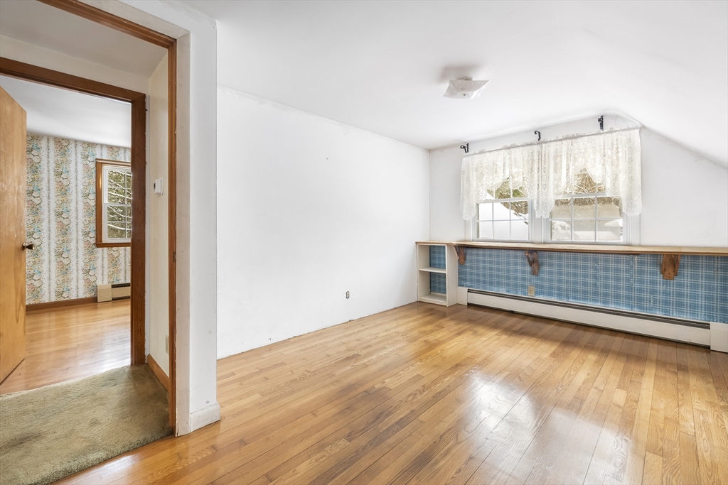 130 S Road Holden, MA 01520 - Photo 22 of 28 a view of an empty room with wooden floor and a window