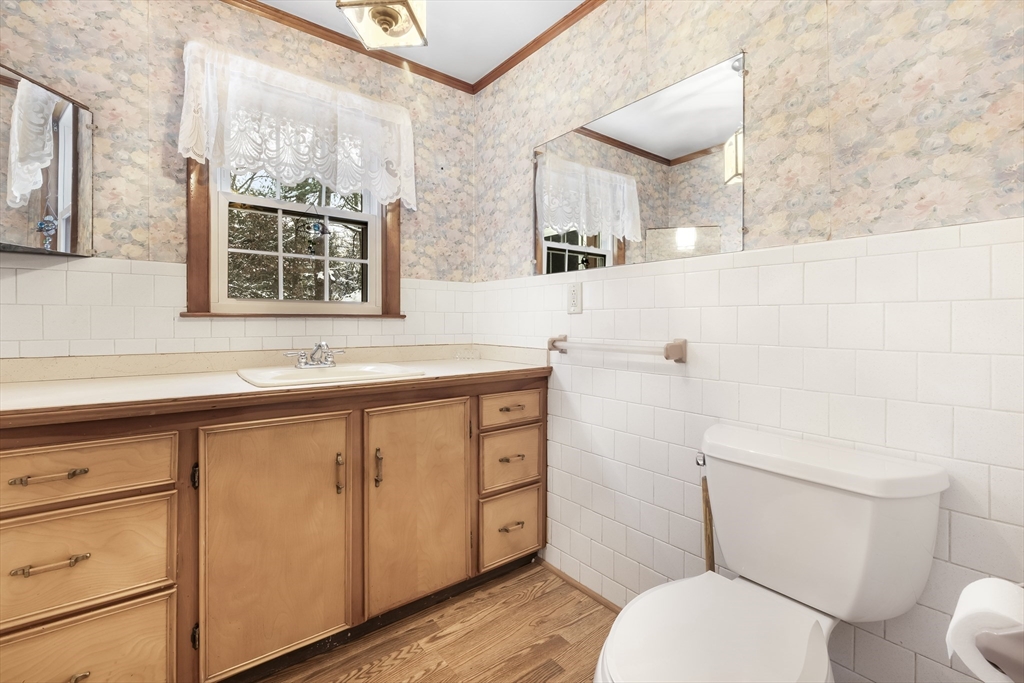 130 S Road Holden, MA 01520 - Photo 24 of 28 a bathroom with a sink a toilet and vanity