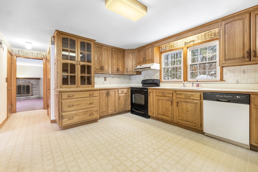 130 S Road Holden, MA 01520 - Photo 5 of 28 a kitchen with stainless steel appliances a stove top oven and a refrigerator