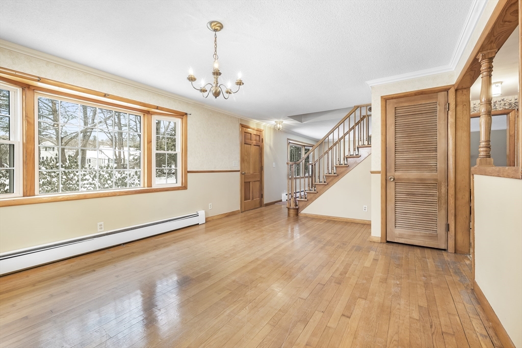 130 S Road Holden, MA 01520 - Photo 8 of 28 a view of an empty room with wooden floor and a window